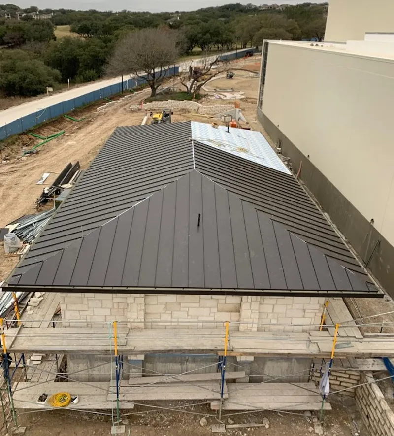 Metal roof new construction with scaffolding in Howell